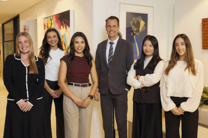 Team members at Holding Redlich | AI PropTech News